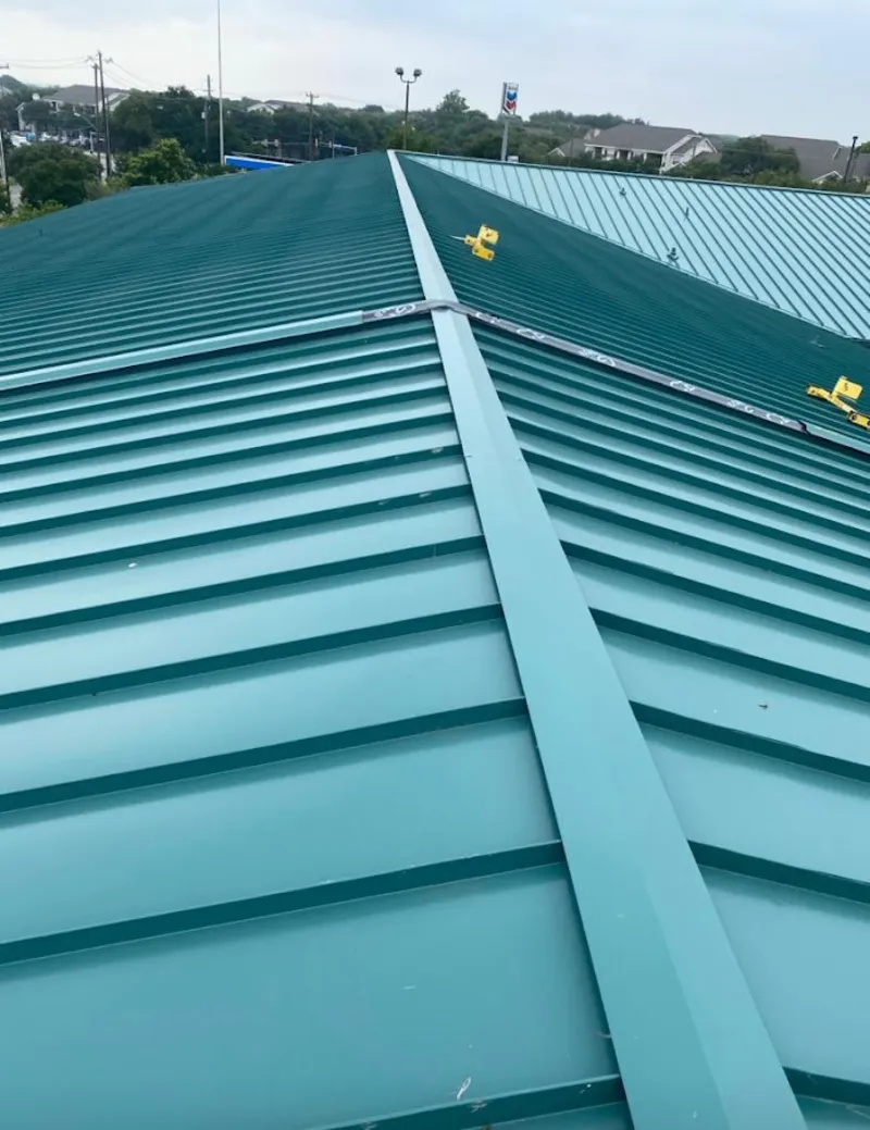 Green commercial metal roof ridge and valley for Metal Roof Repair in Bear Creek